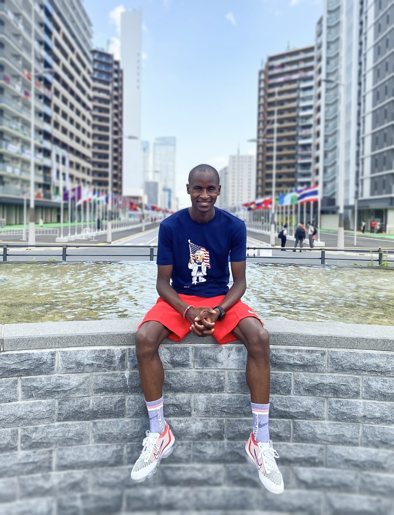 Benard Keter sitting on stones in Tokyo for the Olympic Games 
