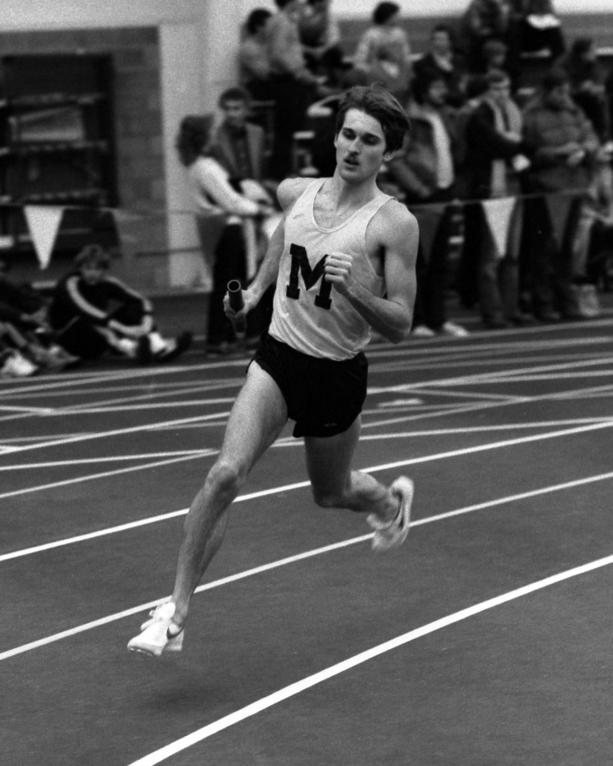 Brian Diemer on the track running a relay for the University of Michigan in 1982