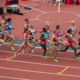 women running on the track from all different countries