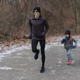 father and son running together in the winter